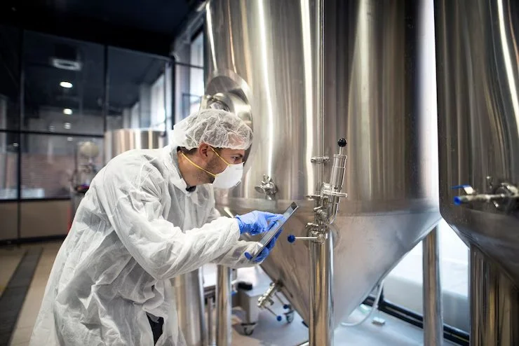 professional-technologist-checking-production-factory_342744-1164